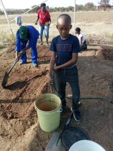 boy filling bucket